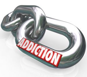 metal chains with addiction written on them - disease of addiction