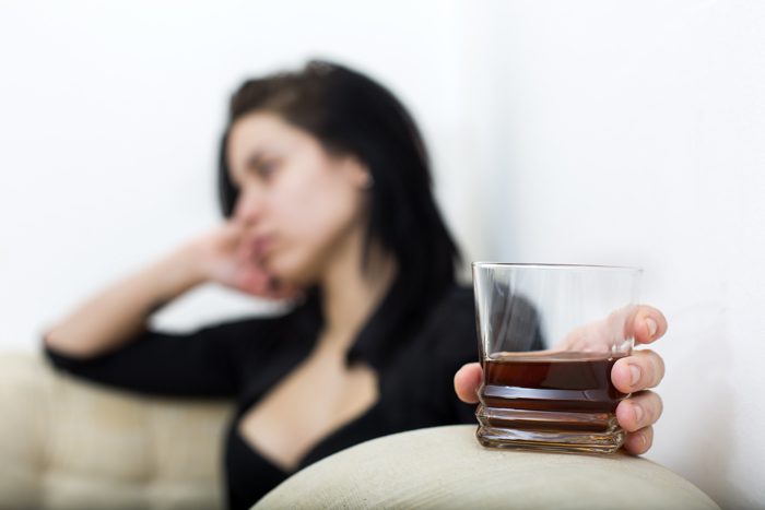 living with an alcoholic - woman drinking - Fair Oaks Recovery Center