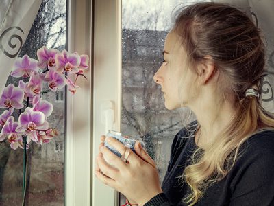 Alcohol Addiction Relapse Consequences - woman looking out window - Fair Oaks Recovery Center