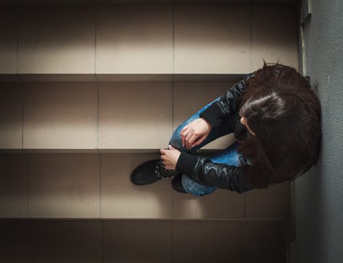 how do you know if someone is addicted to drugs - depressed girl on a staircase