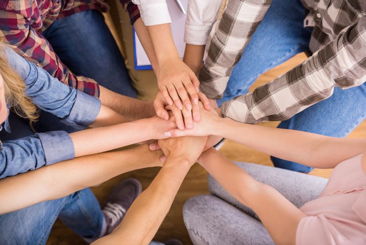 team work - hands in a pile - Fair Oaks Recovery Center - addiction treatment center - intensive outpatient treatment for drug and alcohol addiction