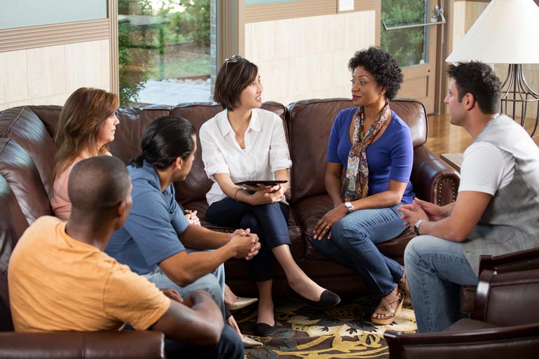 Group Therapy with a Counselor - discussion on a couch
